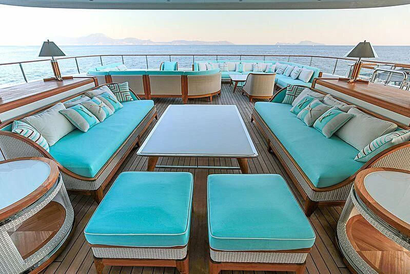 a room with a table chairs and a bed aboard MIMTEE Yacht for Sale