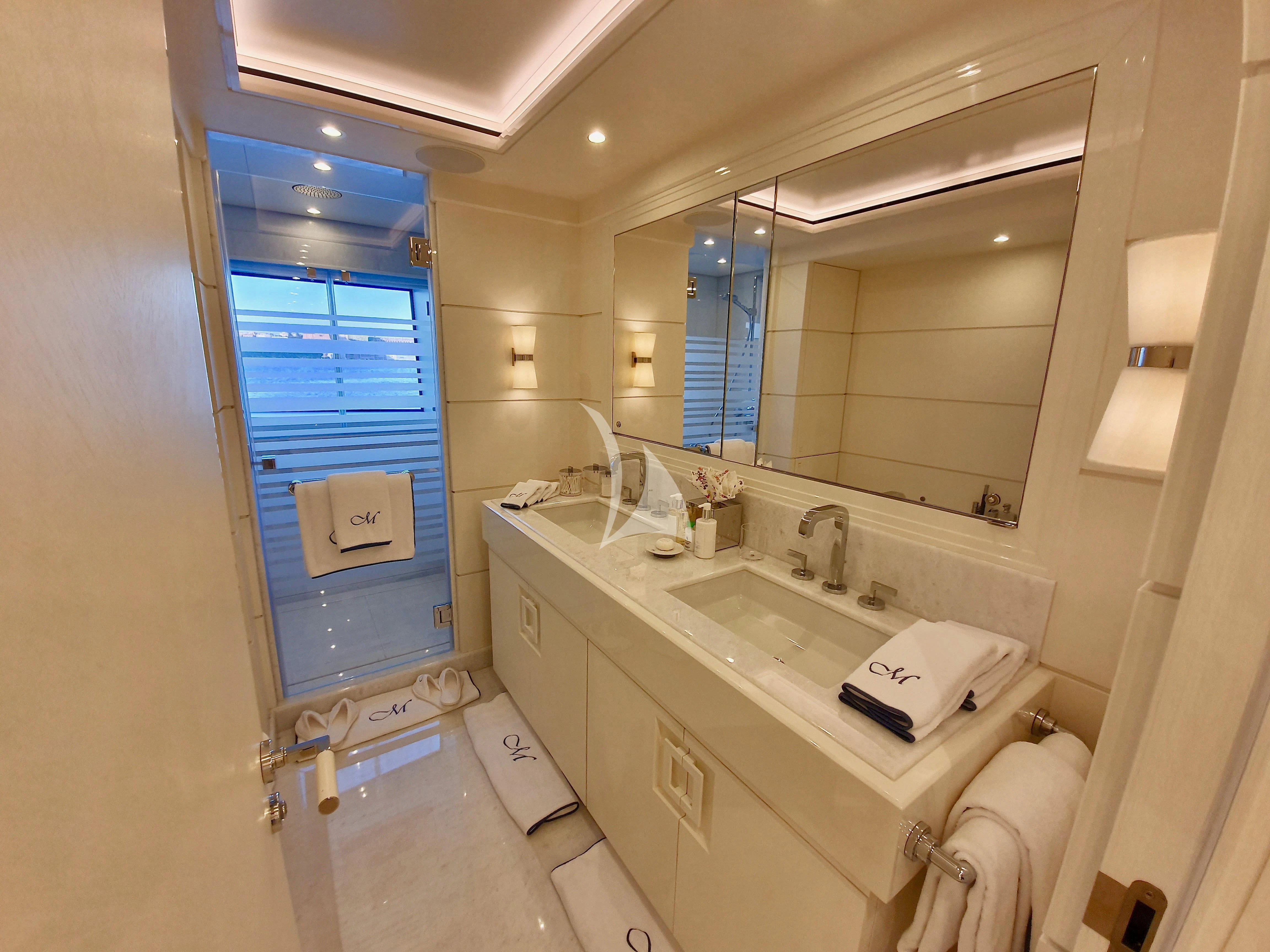 a bathroom with a sink and a mirror aboard MIMTEE Yacht for Sale