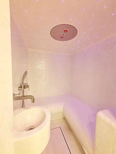 a pink bathroom with a sink and pink walls aboard MIMTEE Yacht for Sale