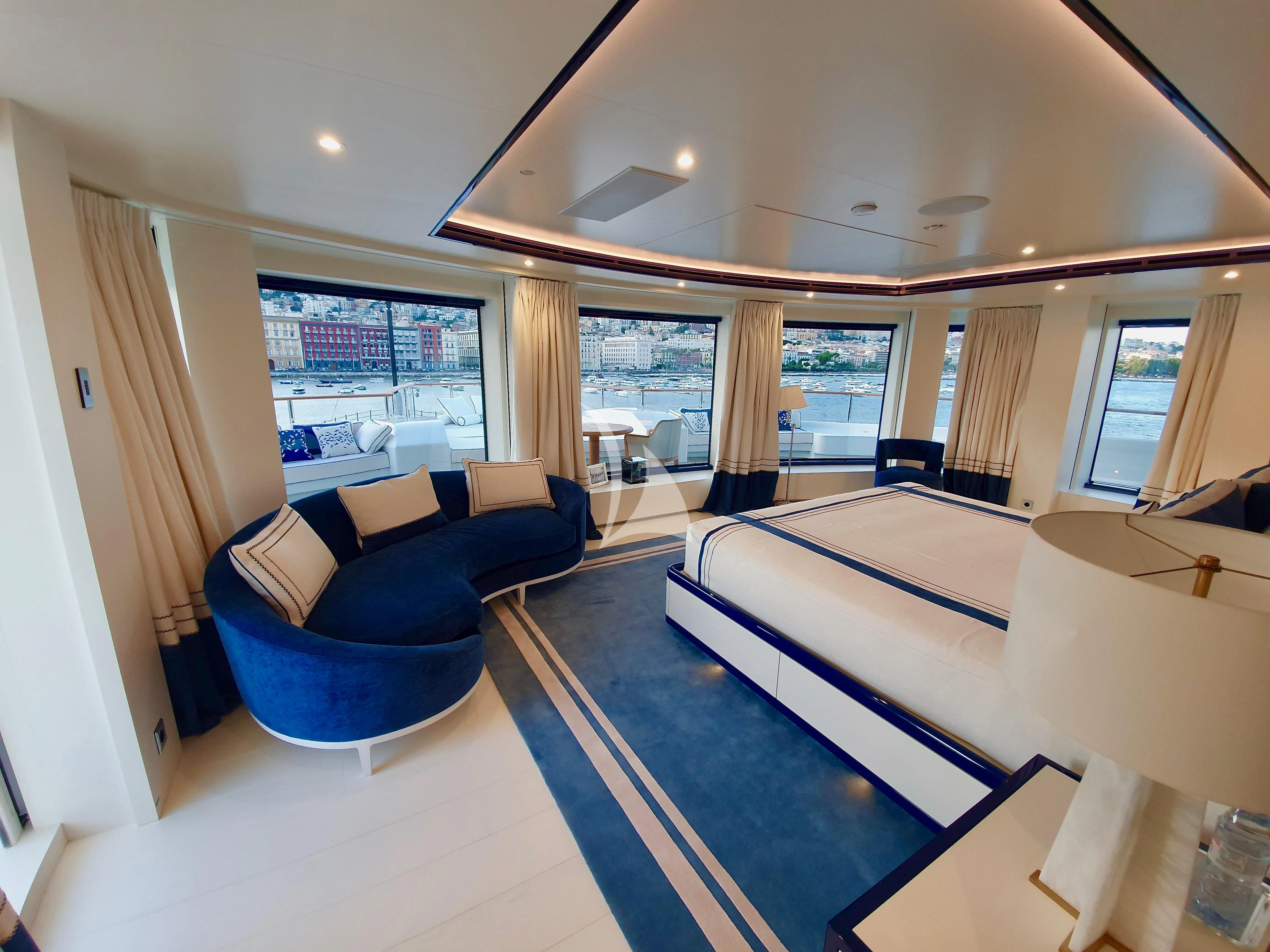 a living room with a large window aboard MIMTEE Yacht for Sale