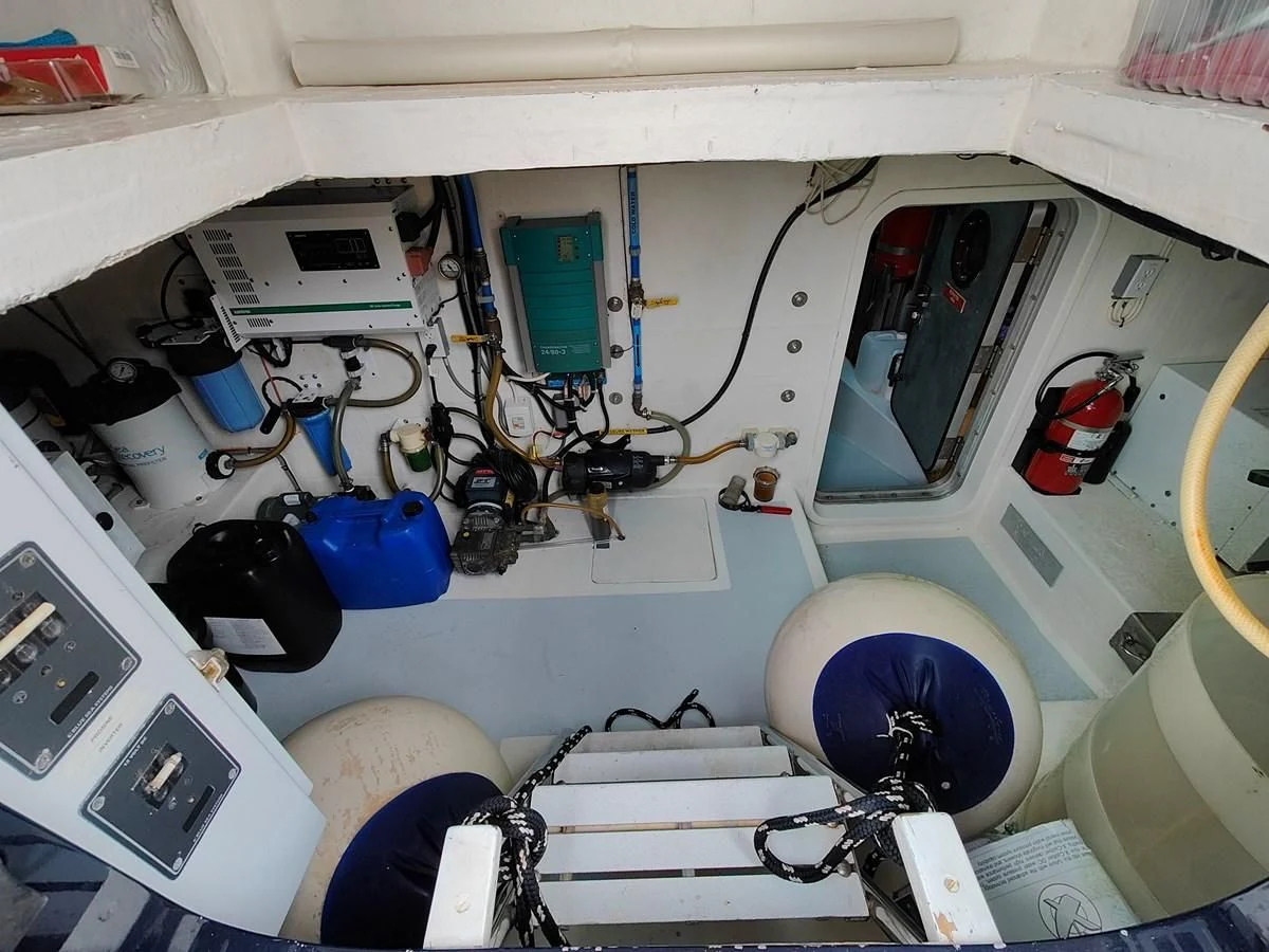 a white vehicle with a blue circle aboard SPELLBOUND Yacht for Sale