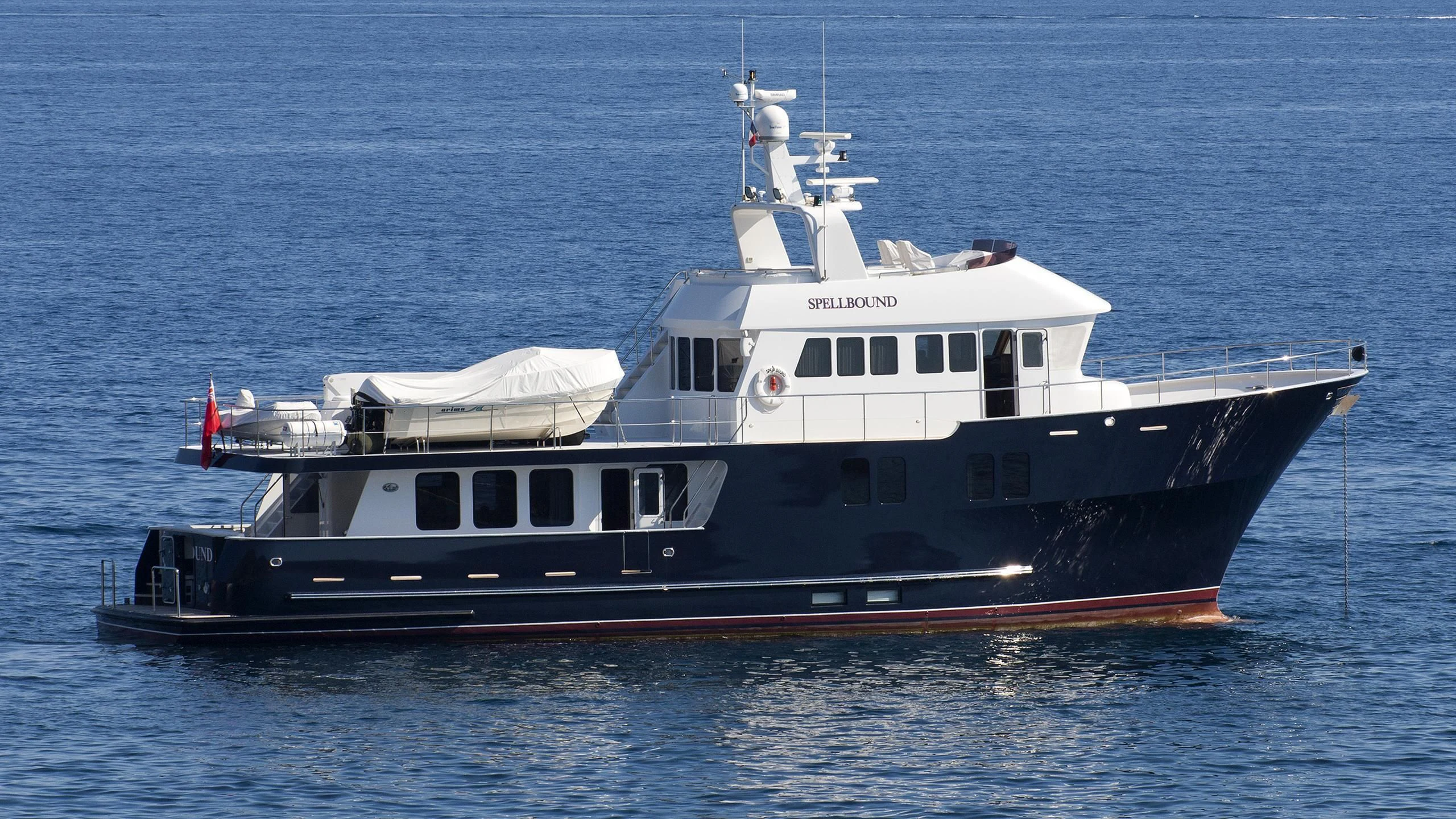 a large boat in the water aboard SPELLBOUND Yacht for Sale