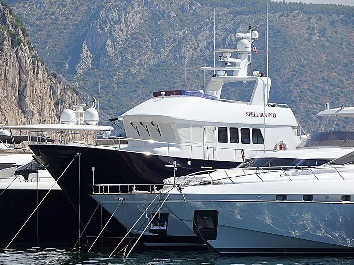 a large white boat in the water aboard SPELLBOUND Yacht for Sale