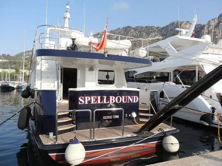 a boat docked at a pier aboard SPELLBOUND Yacht for Sale