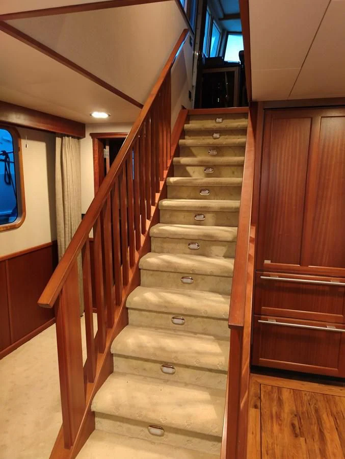 a wooden stair case aboard SPELLBOUND Yacht for Sale