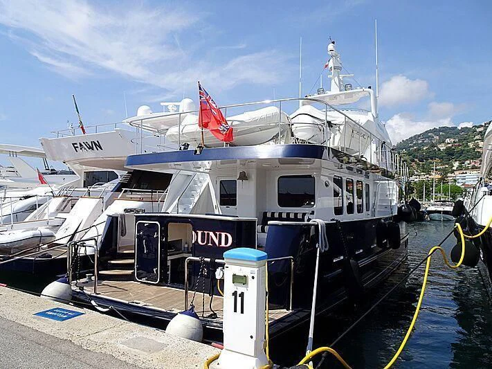 a boat docked at a dock aboard SPELLBOUND Yacht for Sale