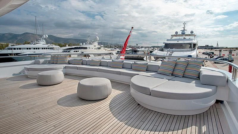 a deck with boats and pillows aboard JAZ Yacht for Charter