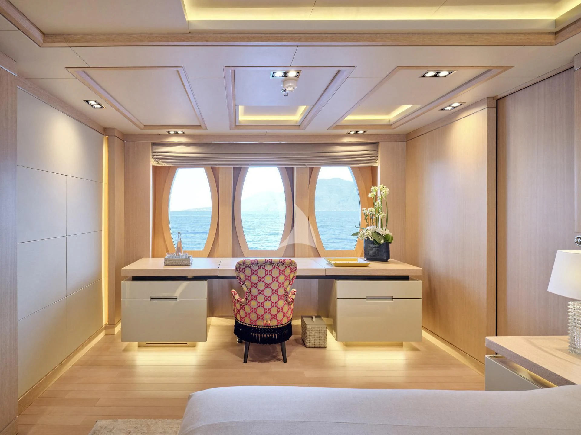 a room with a desk and a chair aboard JAZ Yacht for Charter