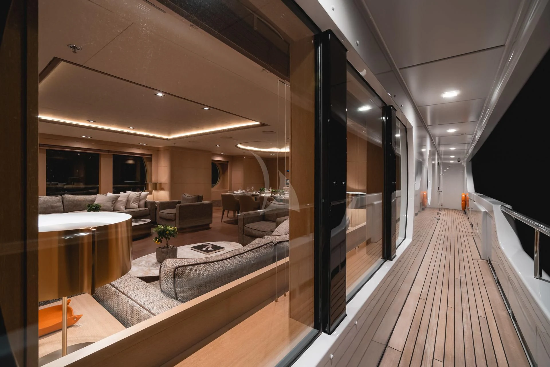 a long hallway with a large window aboard JAZ Yacht for Charter
