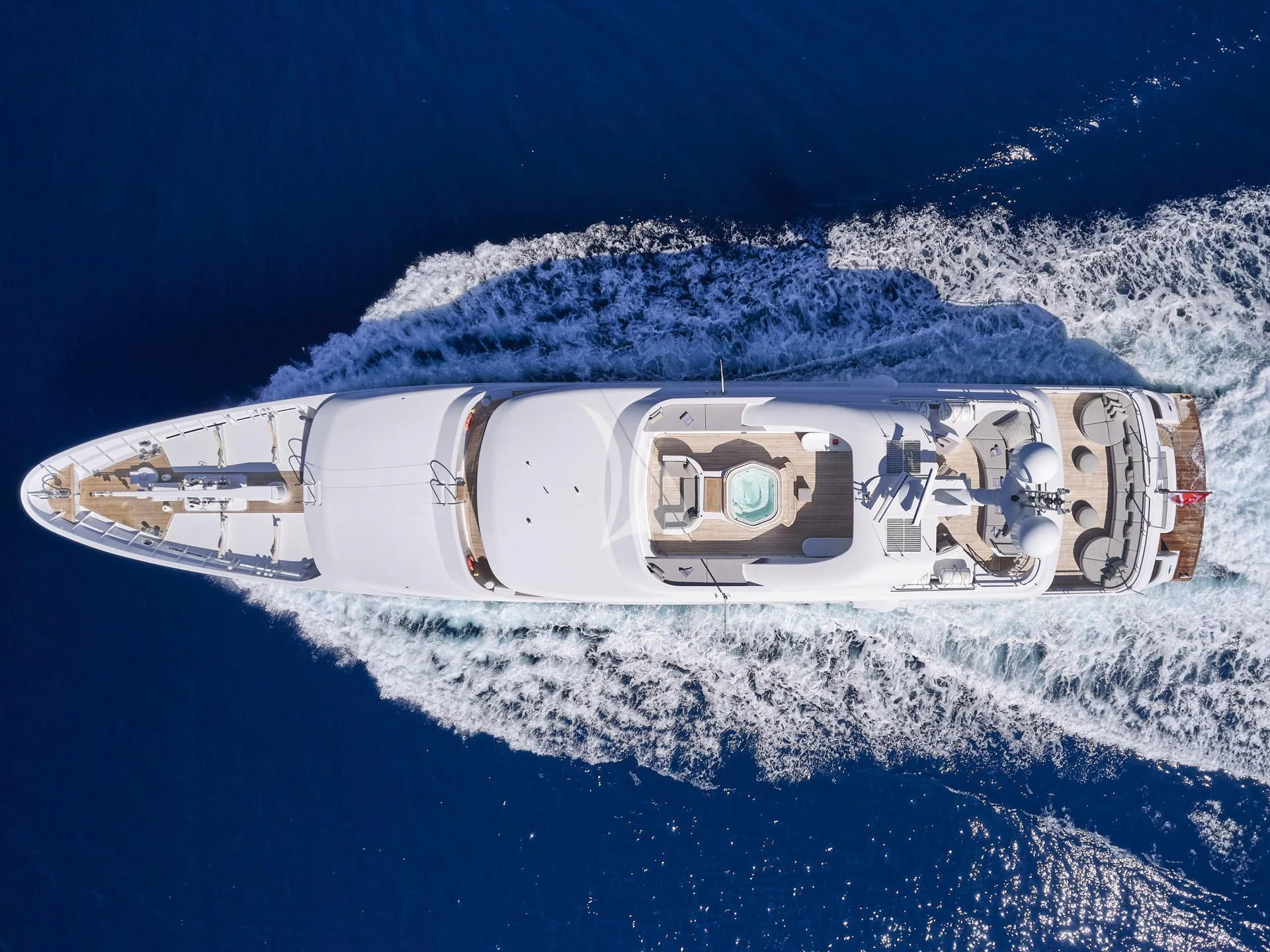 a space shuttle flying over a planet aboard JAZ Yacht for Charter