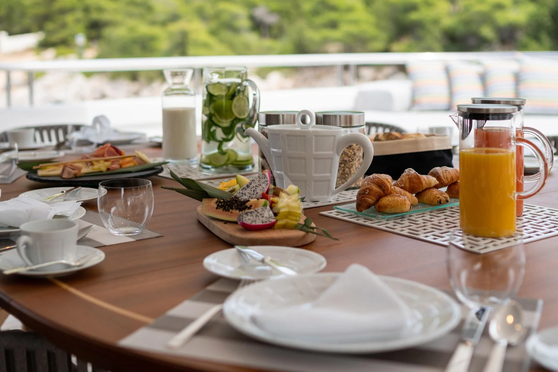 a table with food and drinks on it aboard JAZ Yacht for Charter