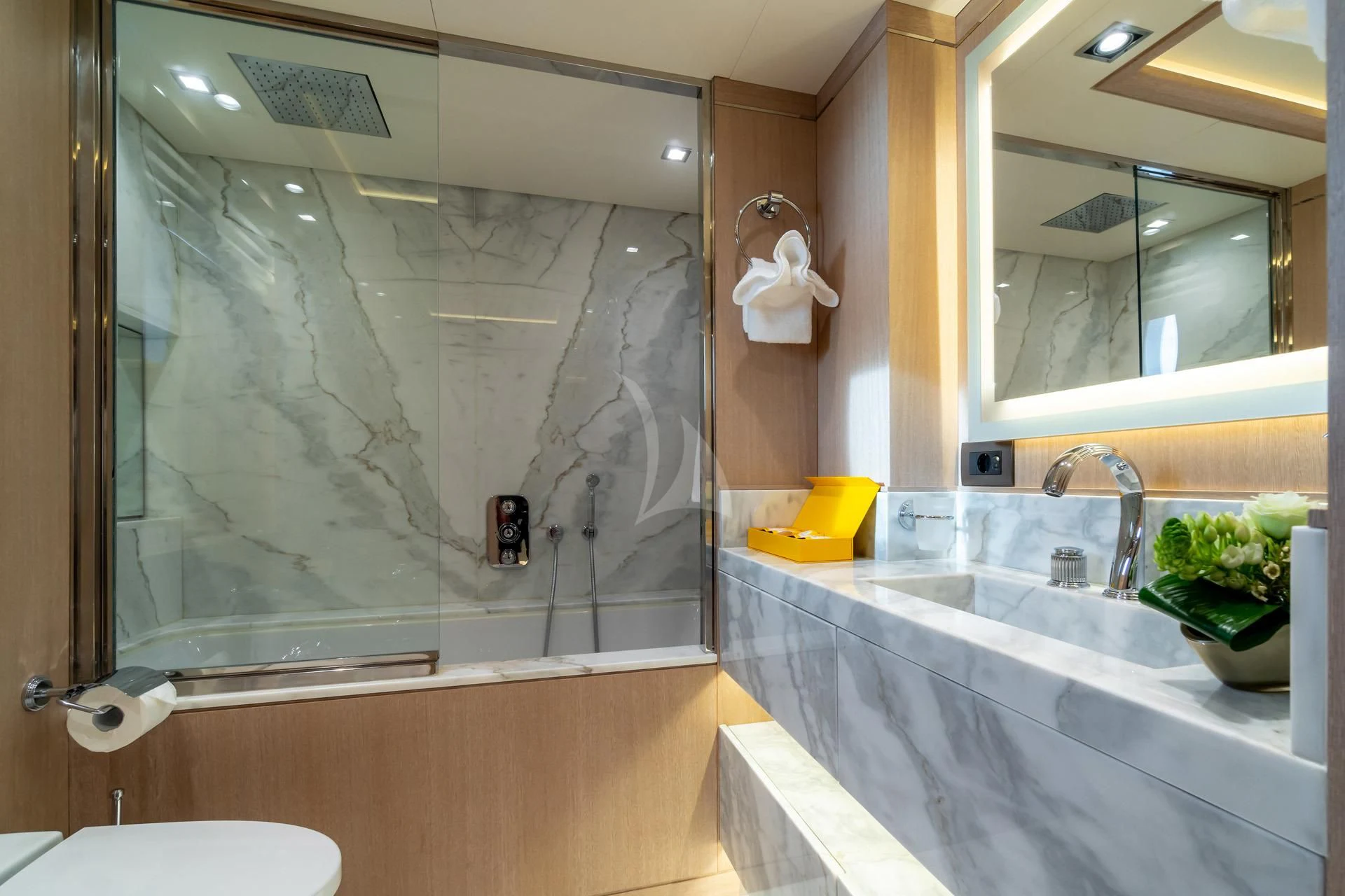 a bathroom with a large mirror aboard JAZ Yacht for Charter