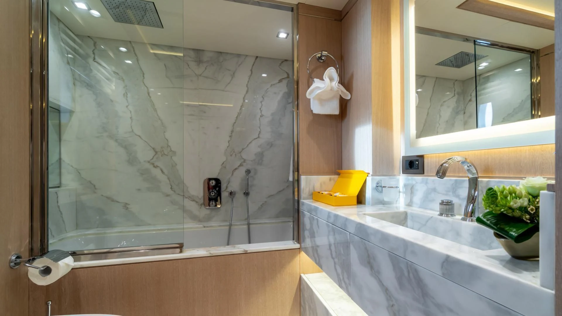 a bathroom with a large mirror aboard JAZ Yacht for Charter