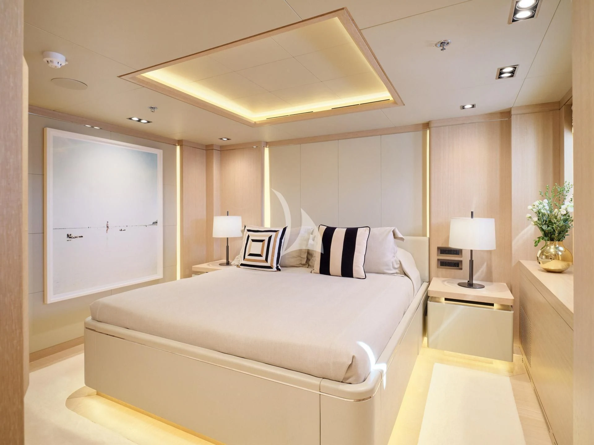 a large white bed in a room aboard JAZ Yacht for Charter