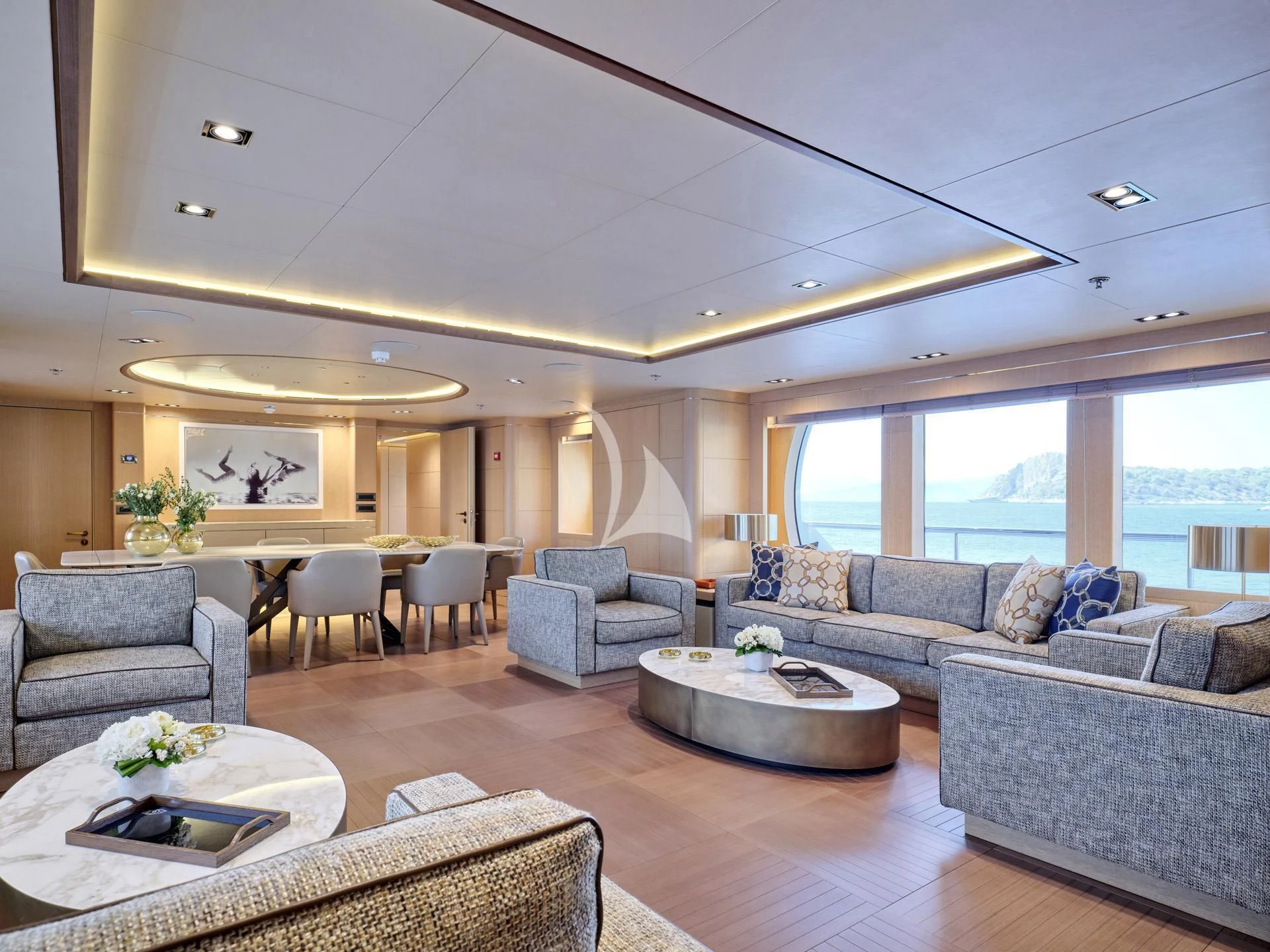 a living room with a large window aboard JAZ Yacht for Charter