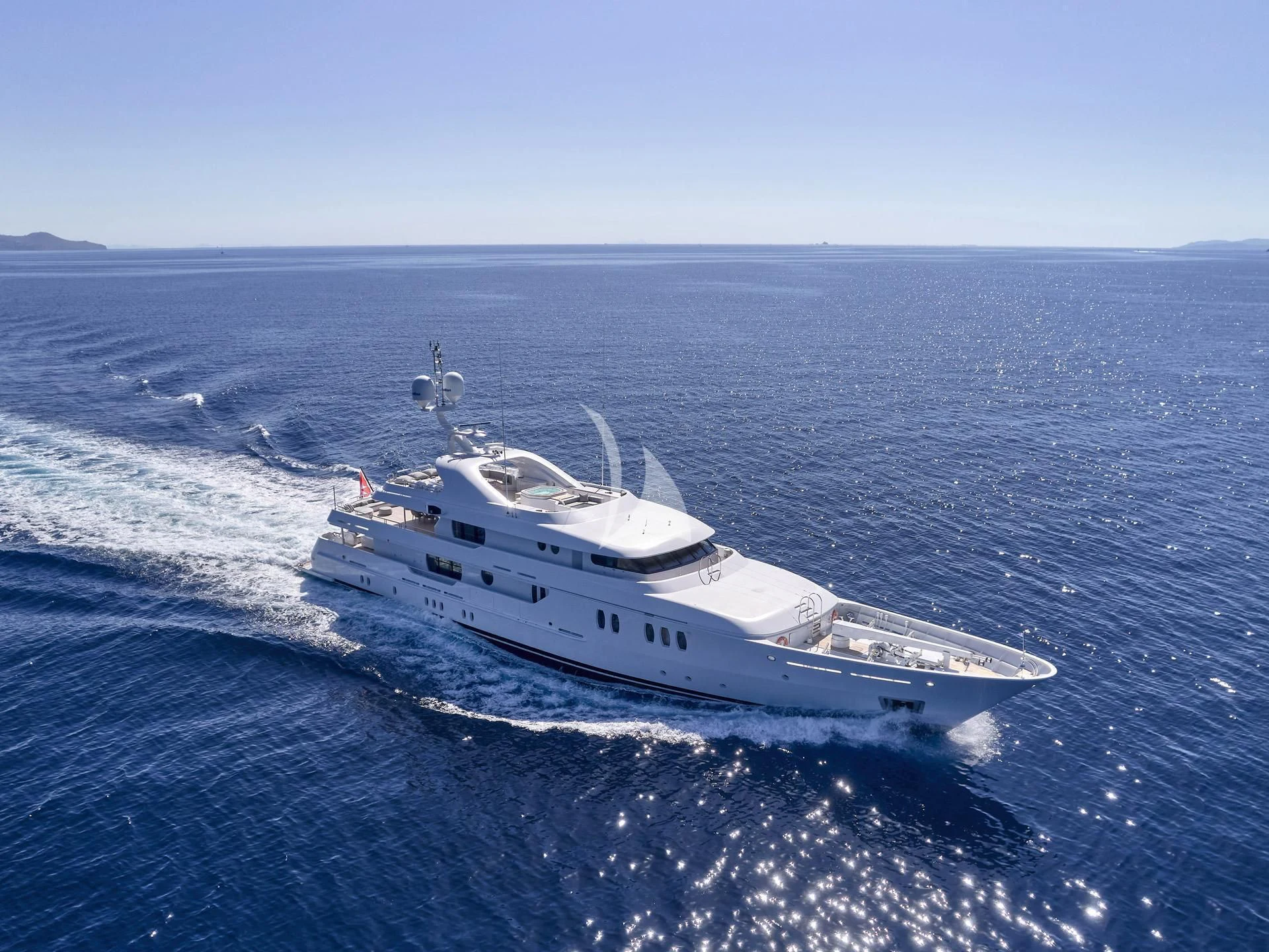 a white boat in the water aboard JAZ Yacht for Charter