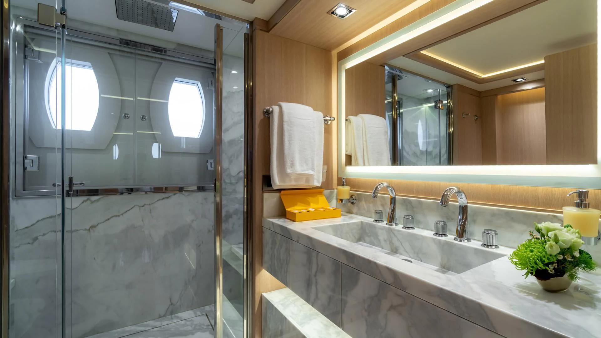 a bathroom with a glass shower aboard JAZ Yacht for Charter