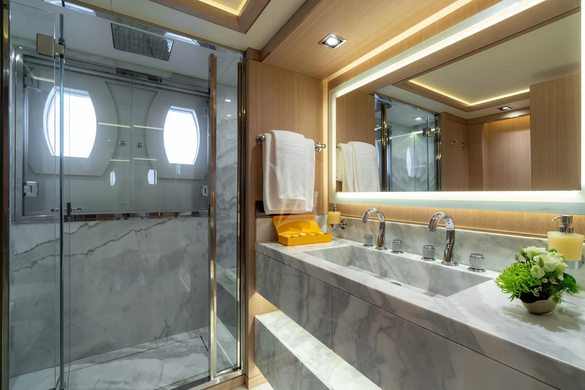 a bathroom with a glass shower aboard JAZ Yacht for Charter
