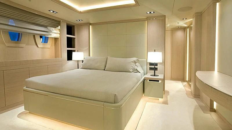 a large bedroom with a bed aboard JAZ Yacht for Charter
