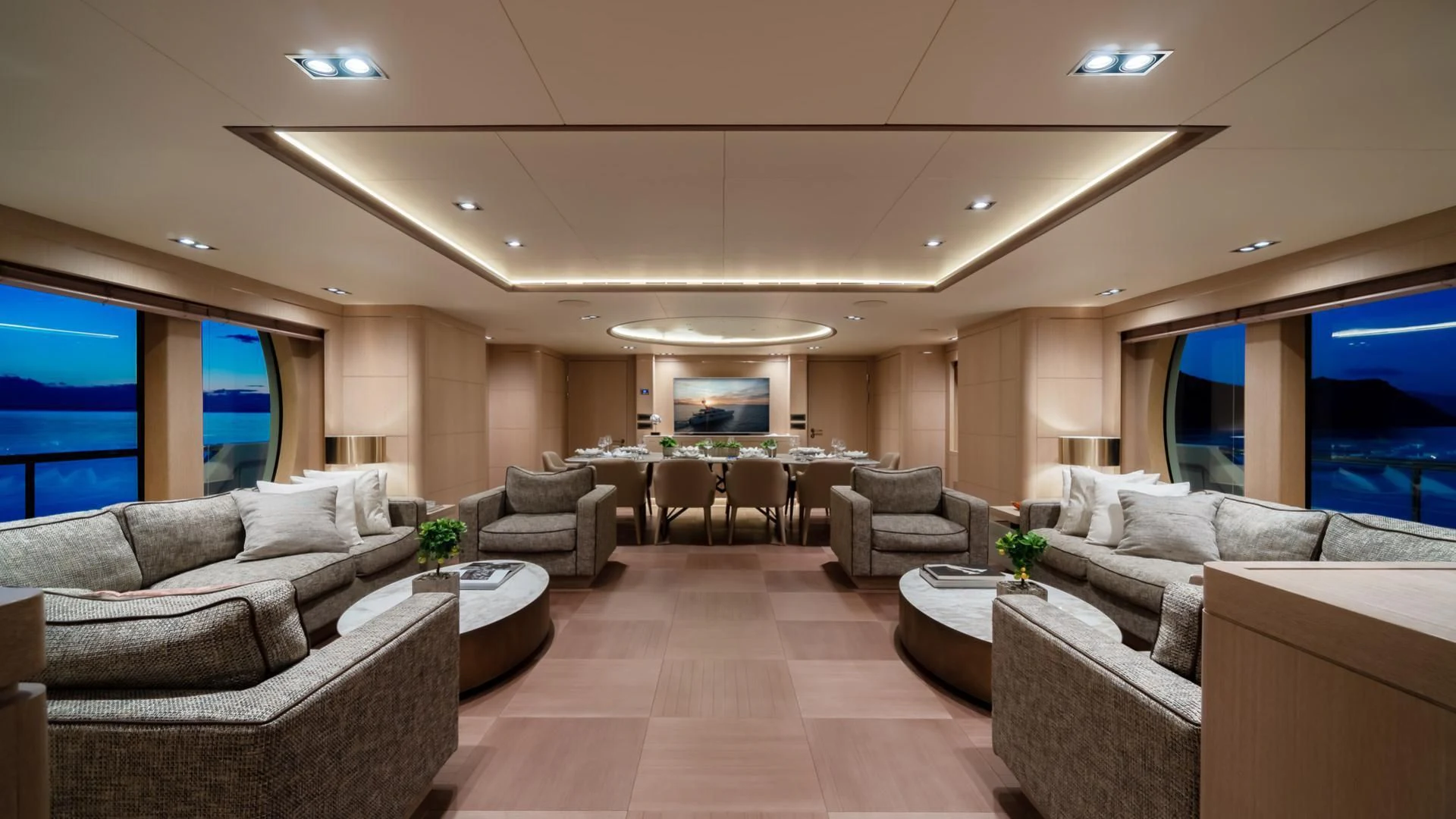 a living room with a large screen aboard JAZ Yacht for Charter