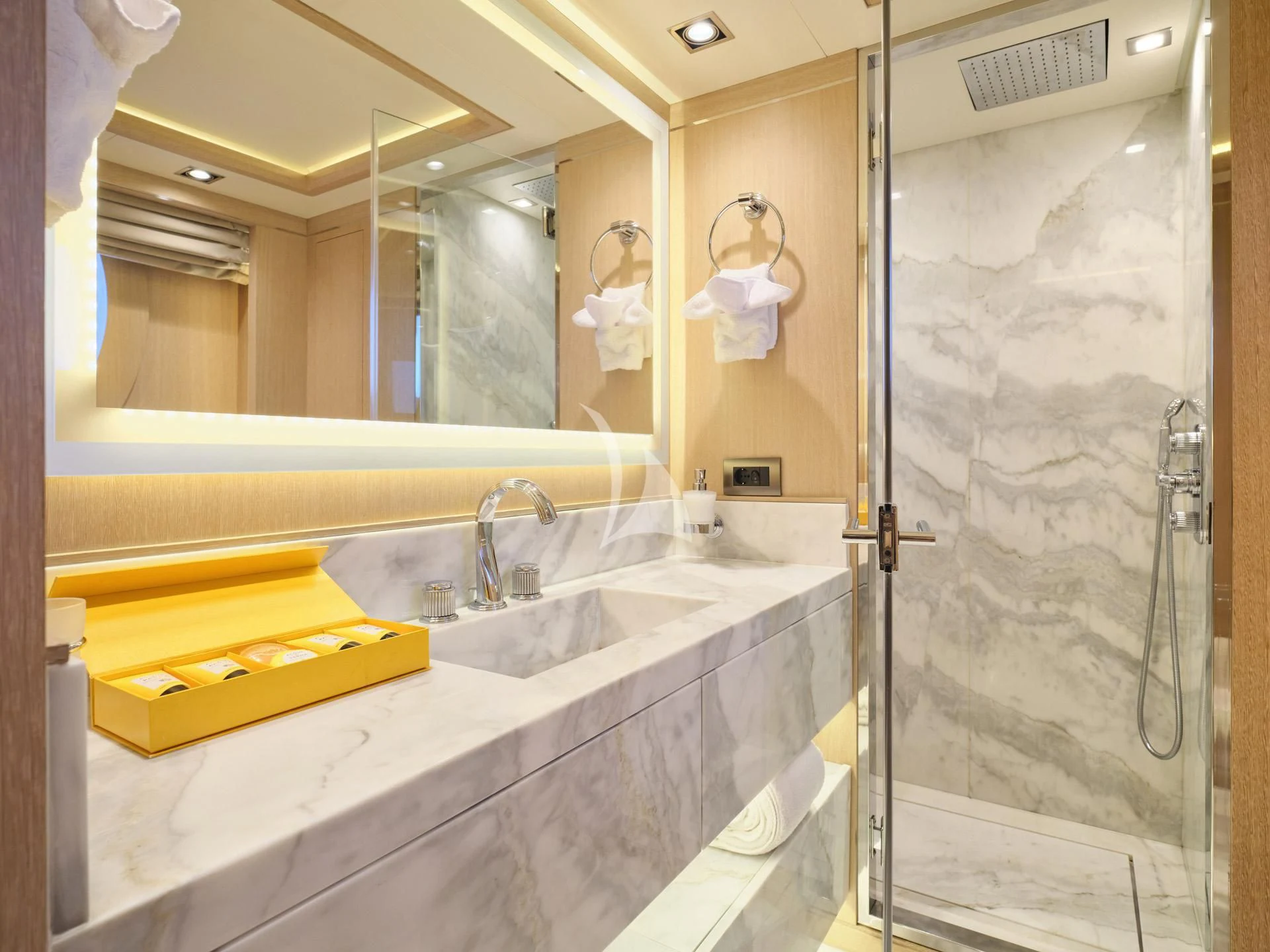 a bathroom with a large mirror aboard JAZ Yacht for Charter