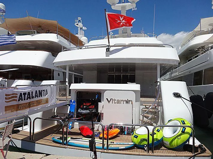 a boat with a flag on the front aboard JAZ Yacht for Charter