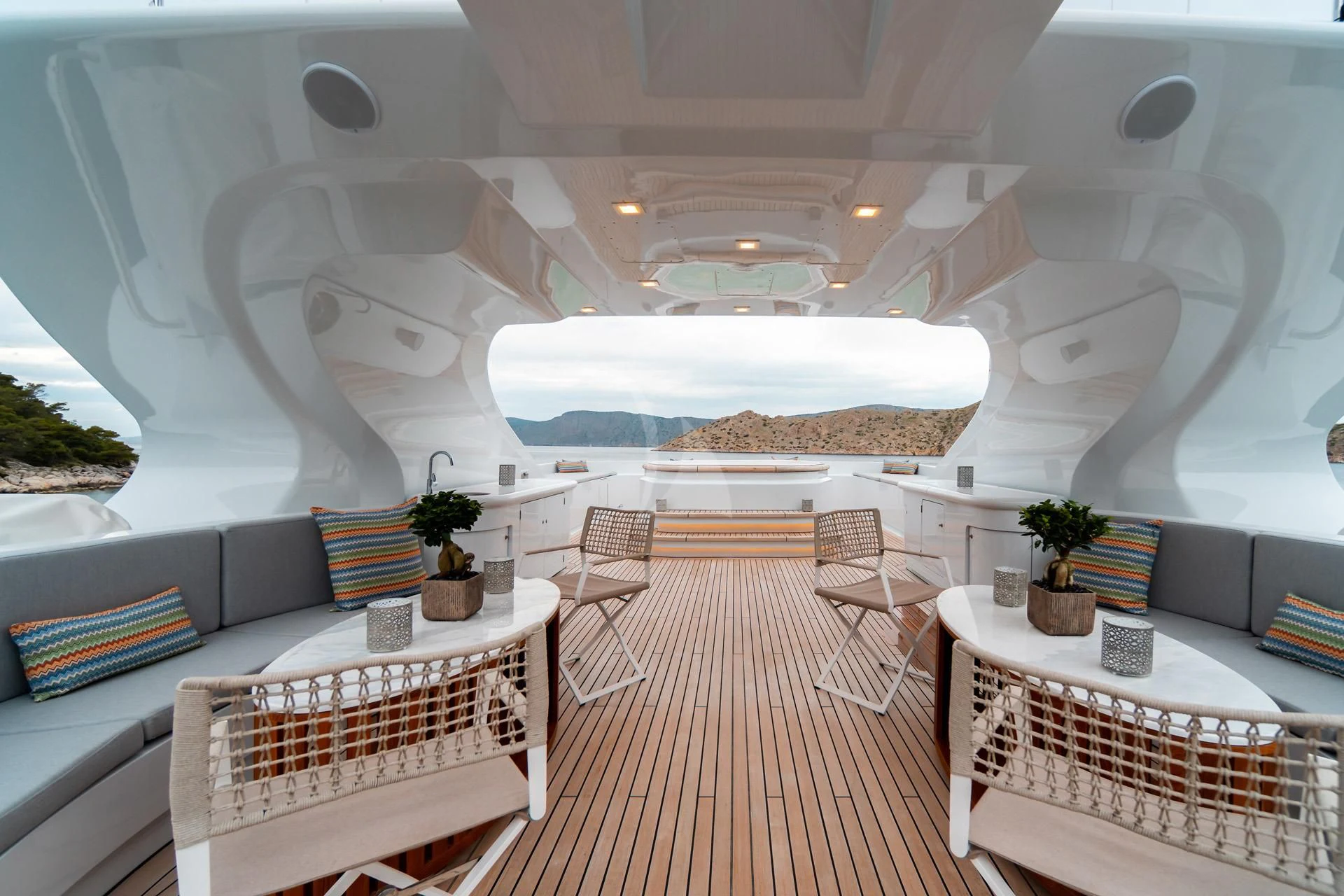 a room with a couch and a table and chairs aboard JAZ Yacht for Charter