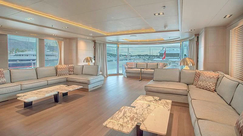 a living room with a large window aboard JAZ Yacht for Charter