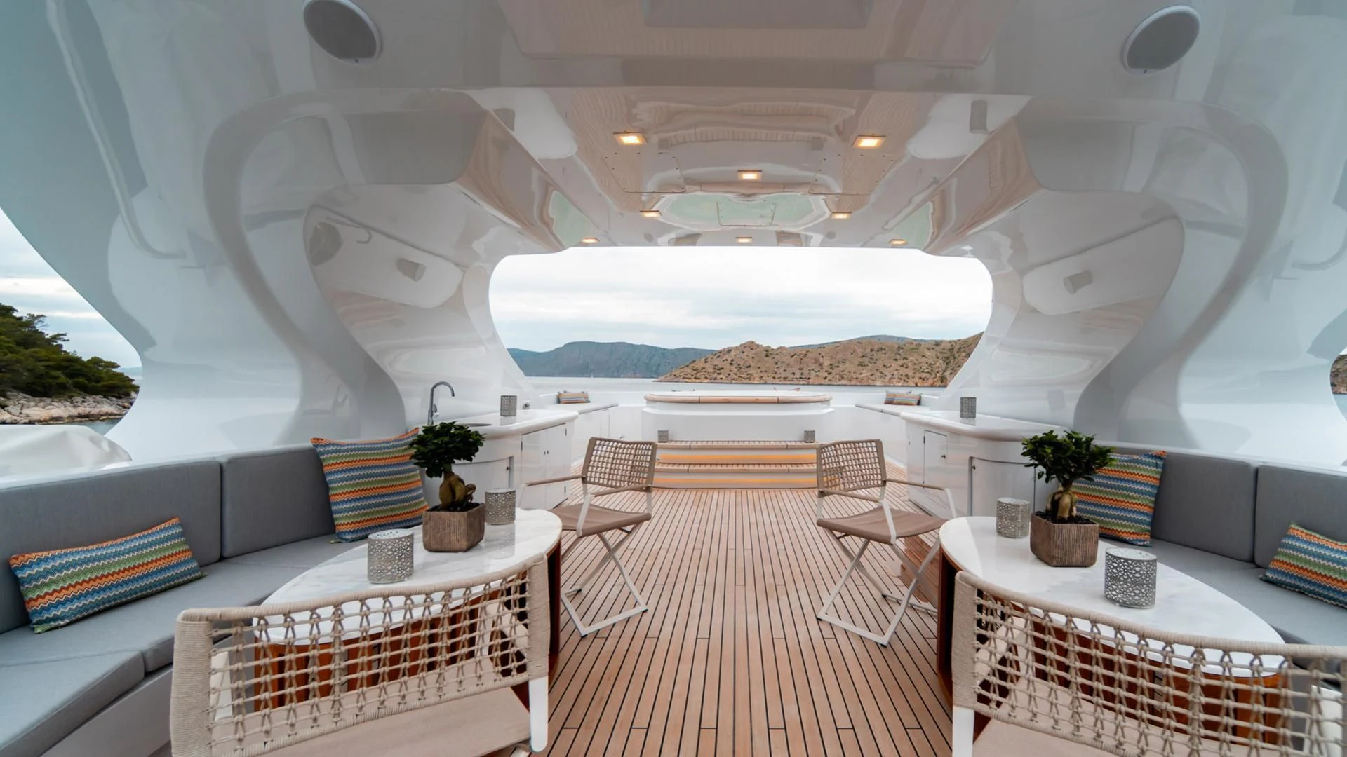 a room with a couch and a table and chairs aboard JAZ Yacht for Charter