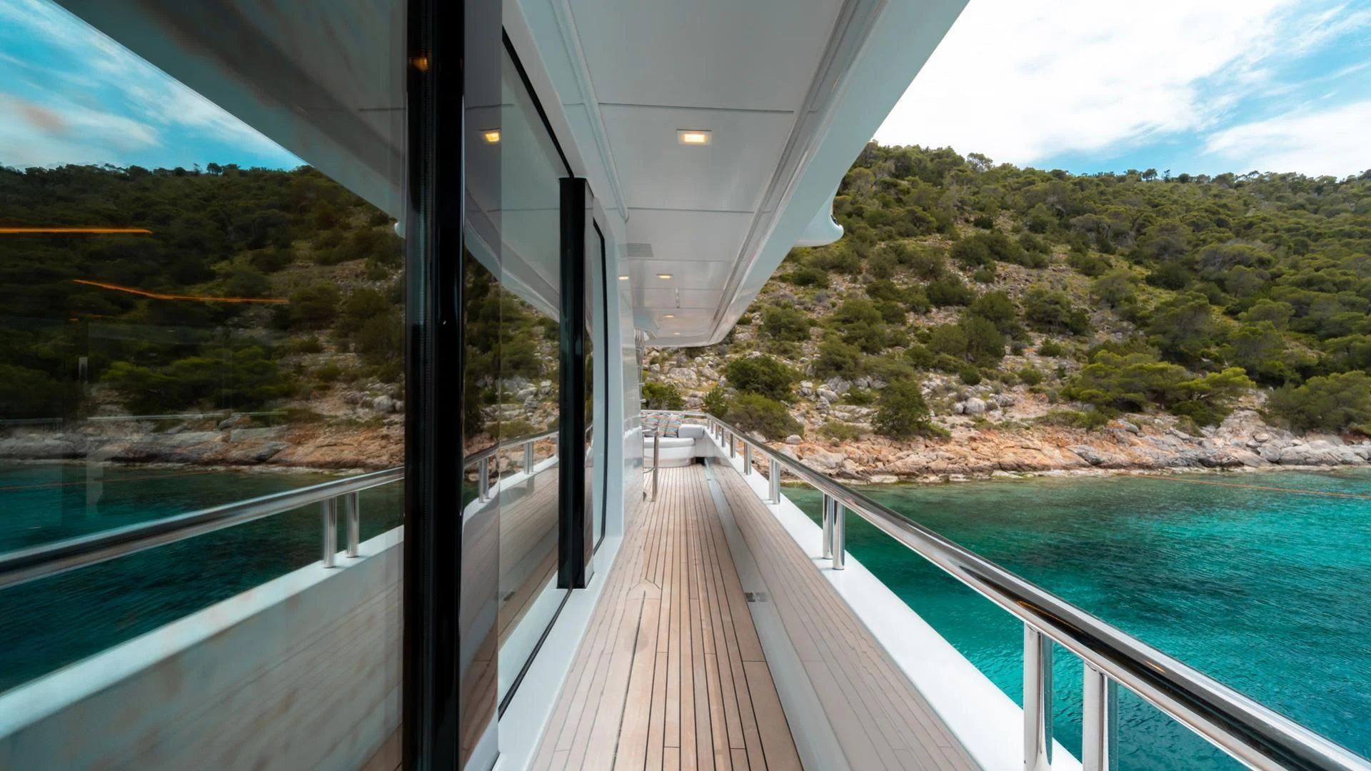 a wooden walkway over water aboard JAZ Yacht for Charter