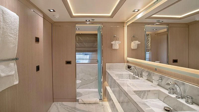 a bathroom with a sink and a shower aboard JAZ Yacht for Charter
