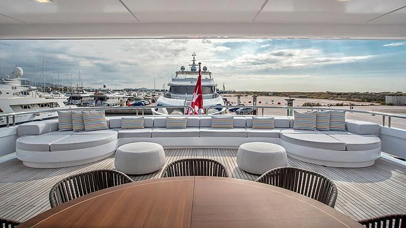 a deck with a view of a marina and boats aboard JAZ Yacht for Charter