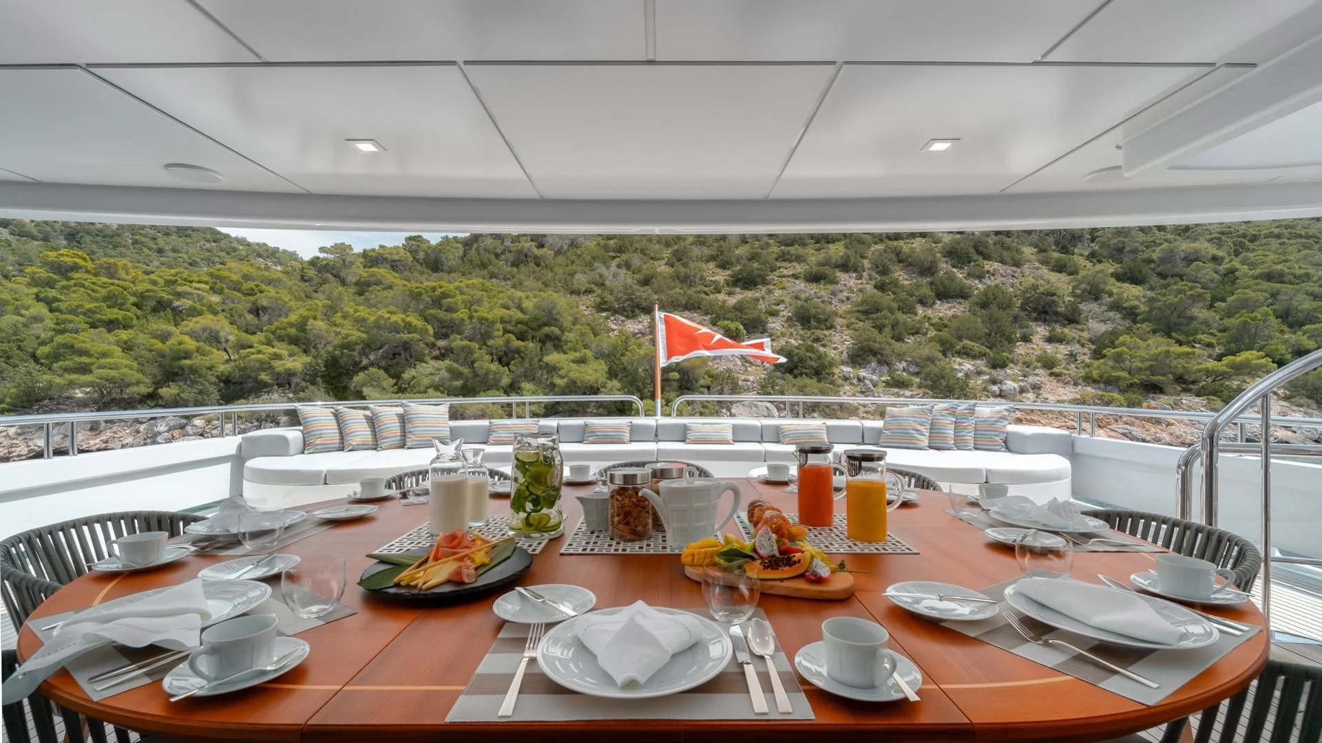 a table set with food and drinks aboard JAZ Yacht for Charter