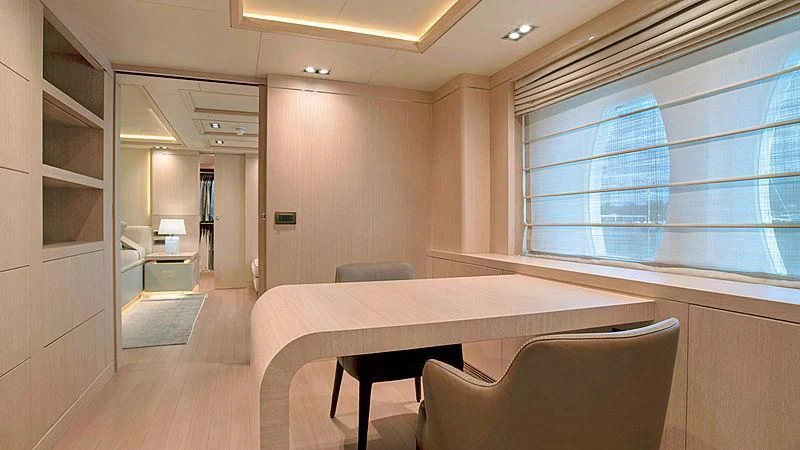 a room with a table and chairs aboard JAZ Yacht for Charter