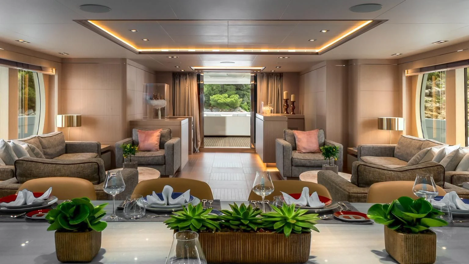 a large living room with a large table and chairs aboard JAZ Yacht for Charter
