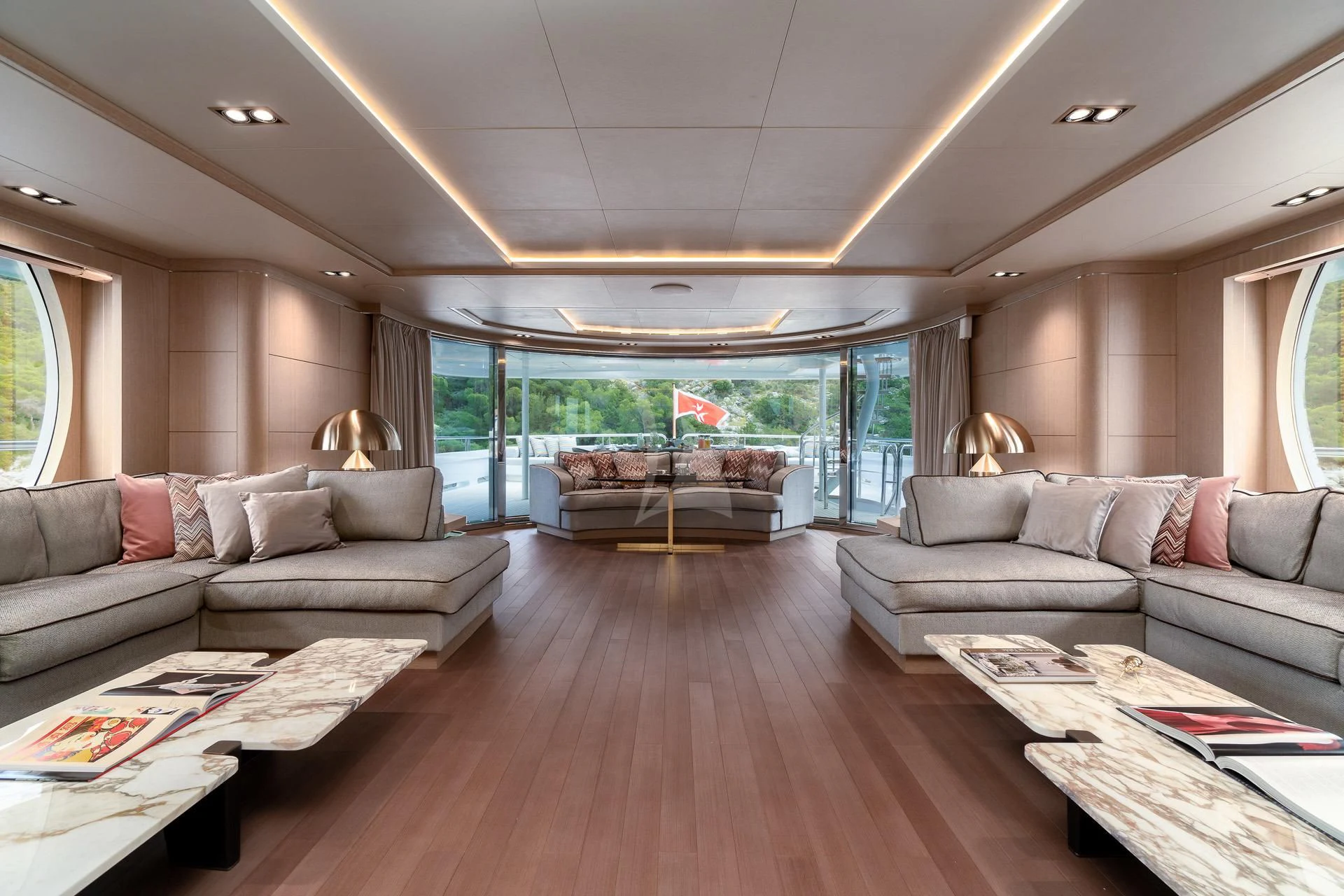a living room with a large window aboard JAZ Yacht for Charter