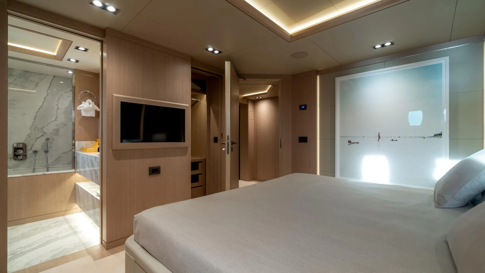 a hotel room with a bed and tv aboard JAZ Yacht for Charter