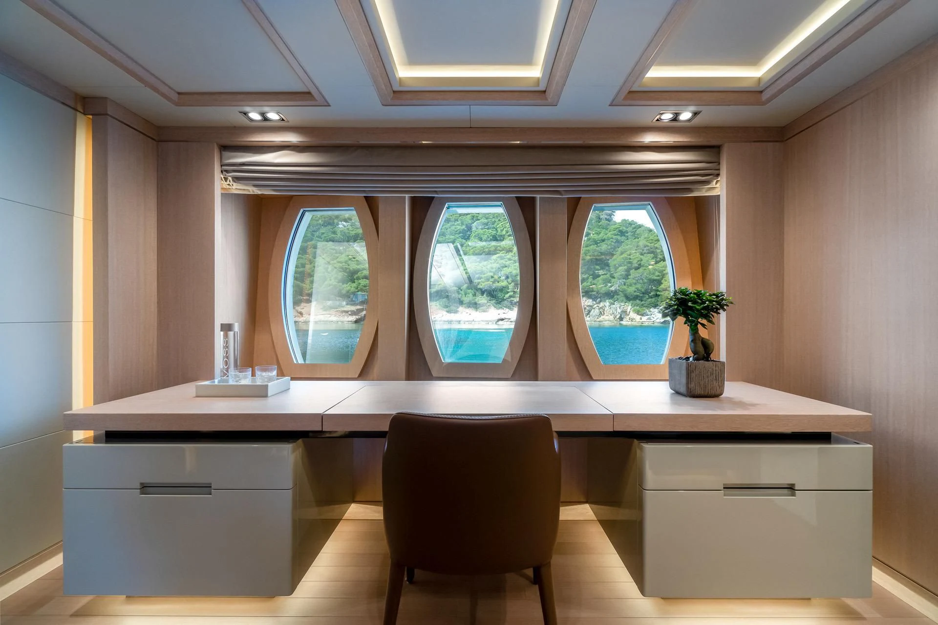 a room with a desk and a chair aboard JAZ Yacht for Charter