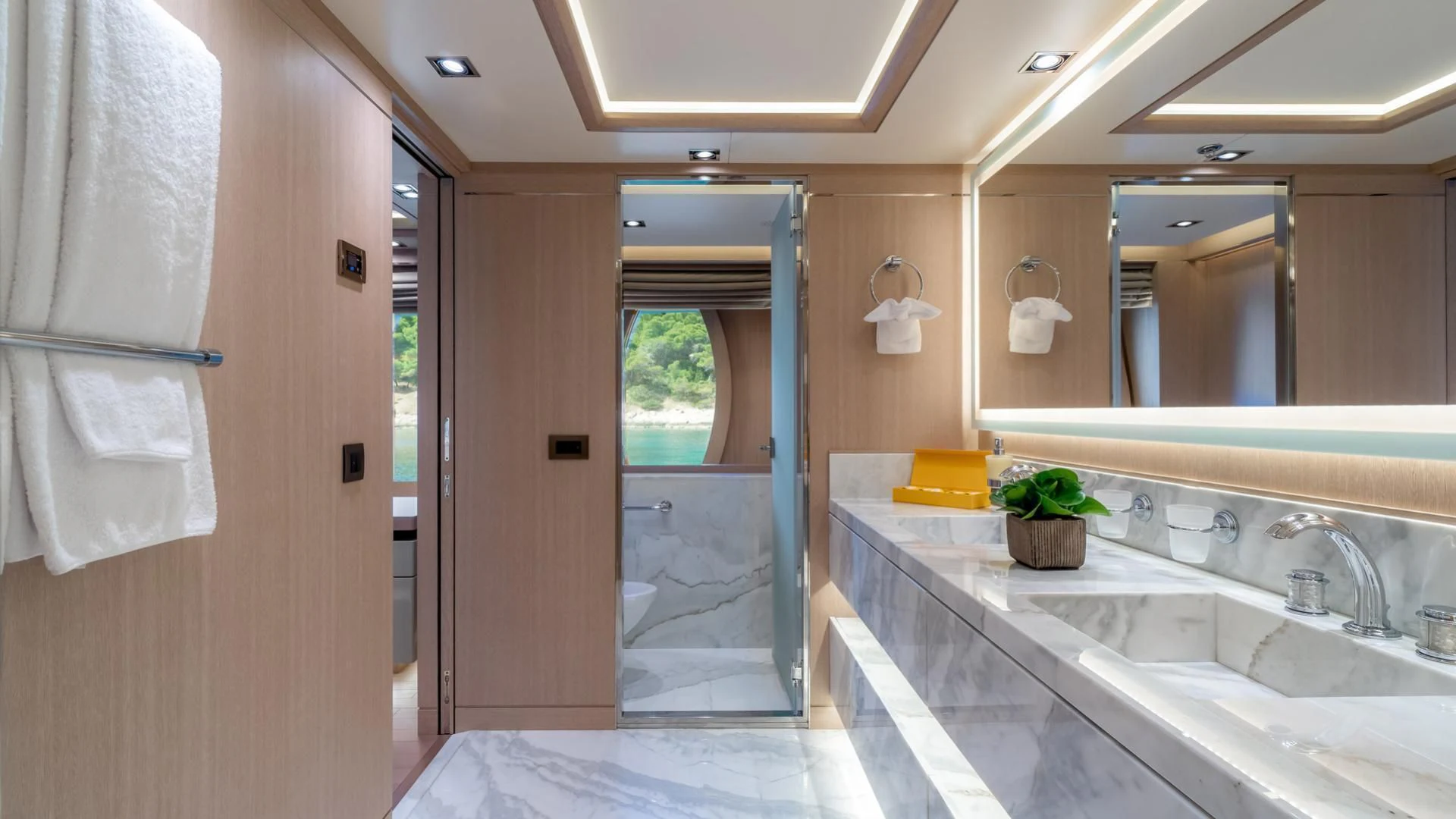 a bathroom with a tub sink and a mirror aboard JAZ Yacht for Charter