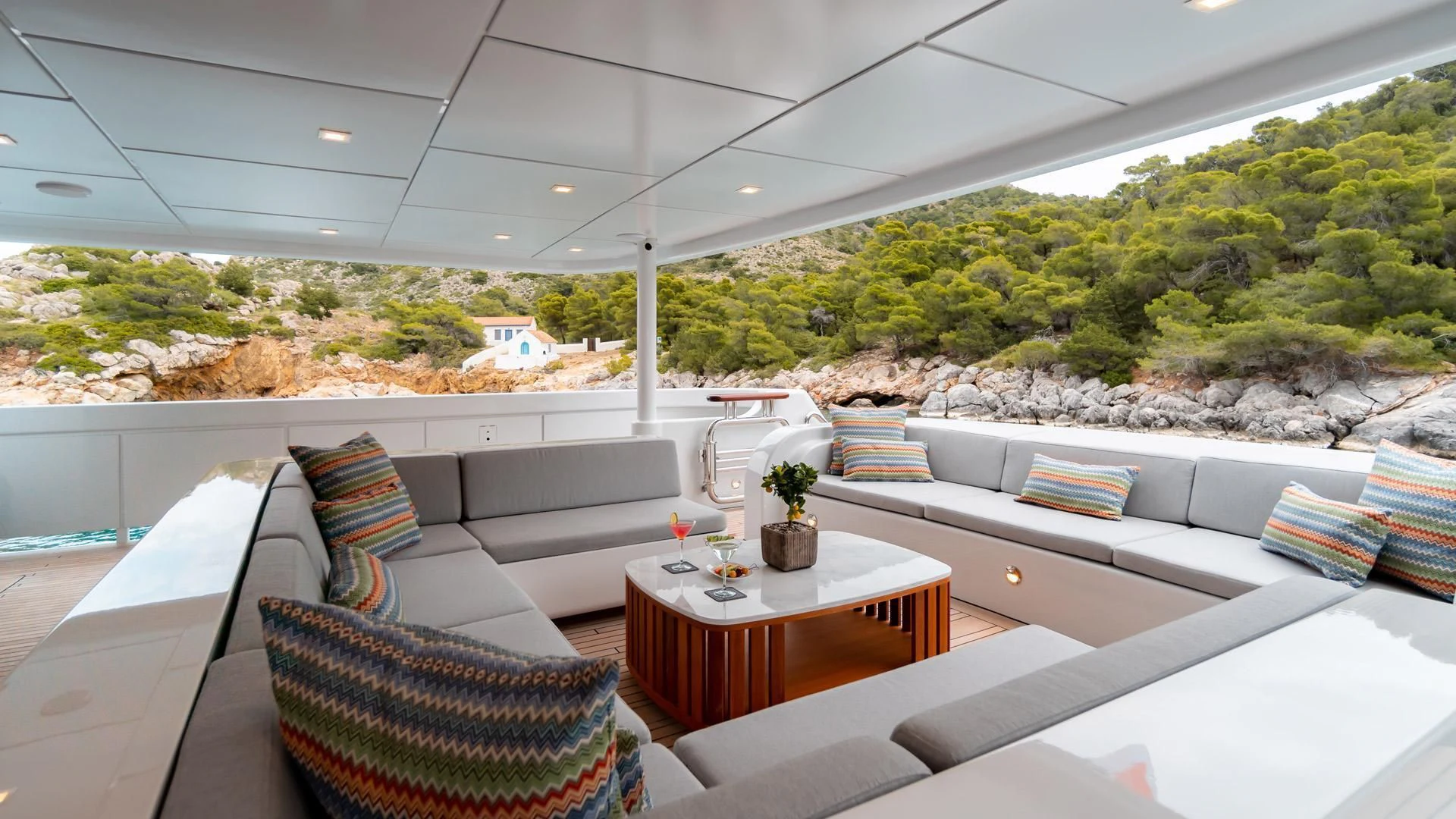 a room with a table and chairs aboard JAZ Yacht for Charter