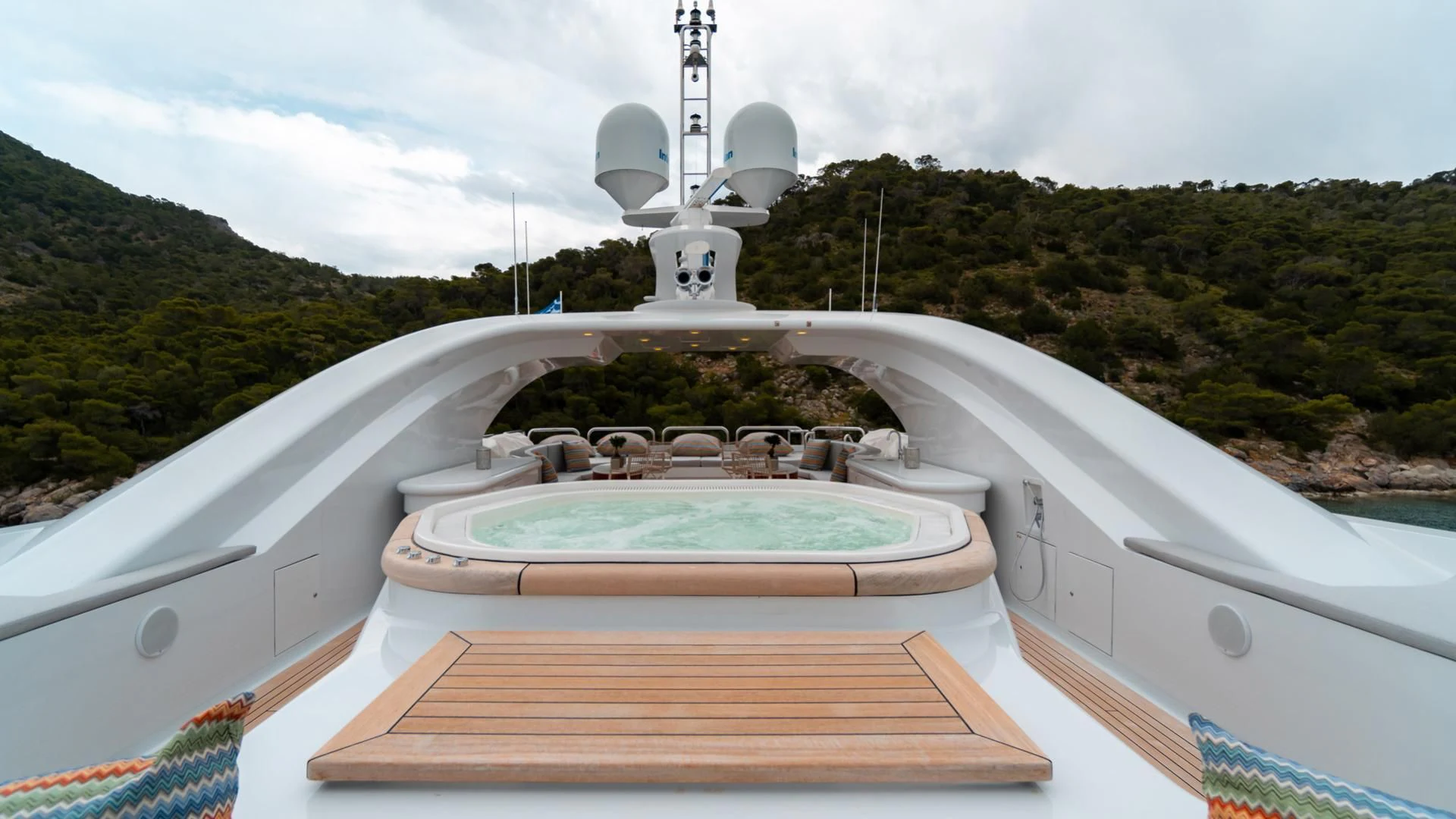 a large white building with a water fountain in the middle aboard JAZ Yacht for Charter