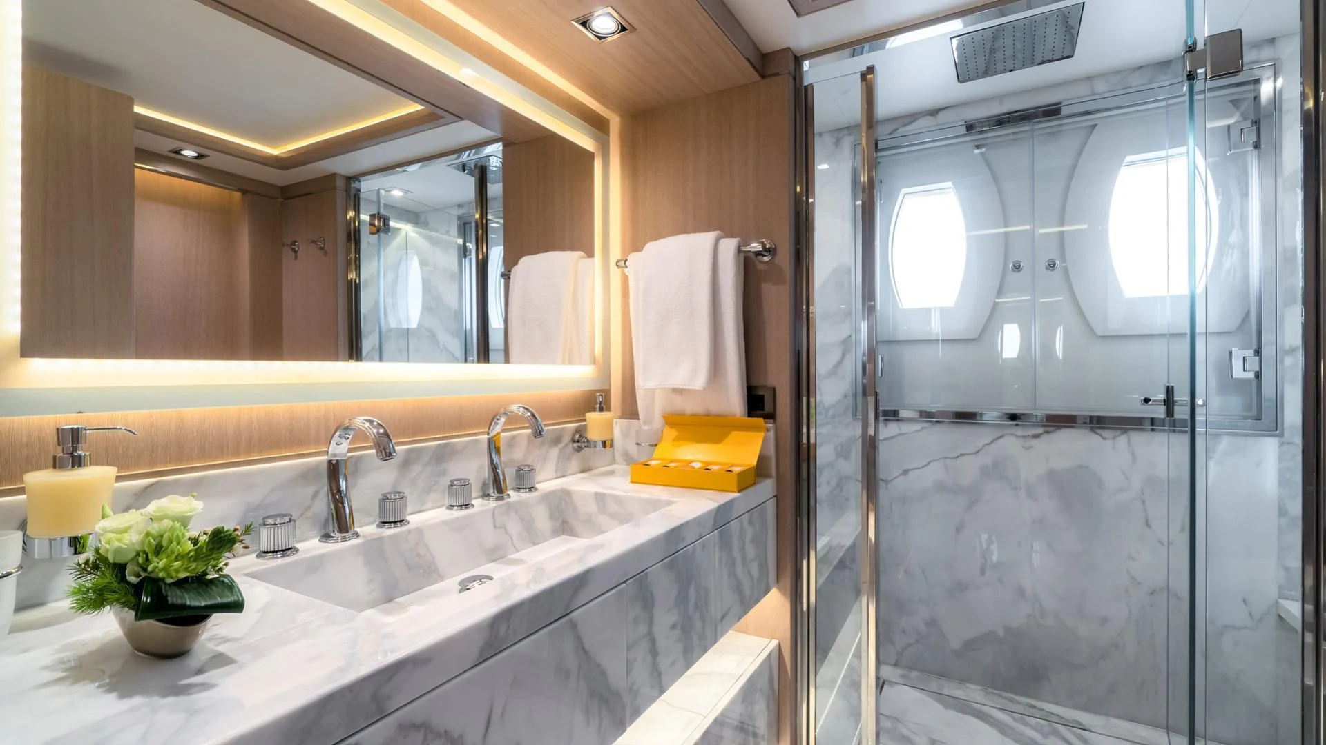 a bathroom with a glass shower aboard JAZ Yacht for Charter