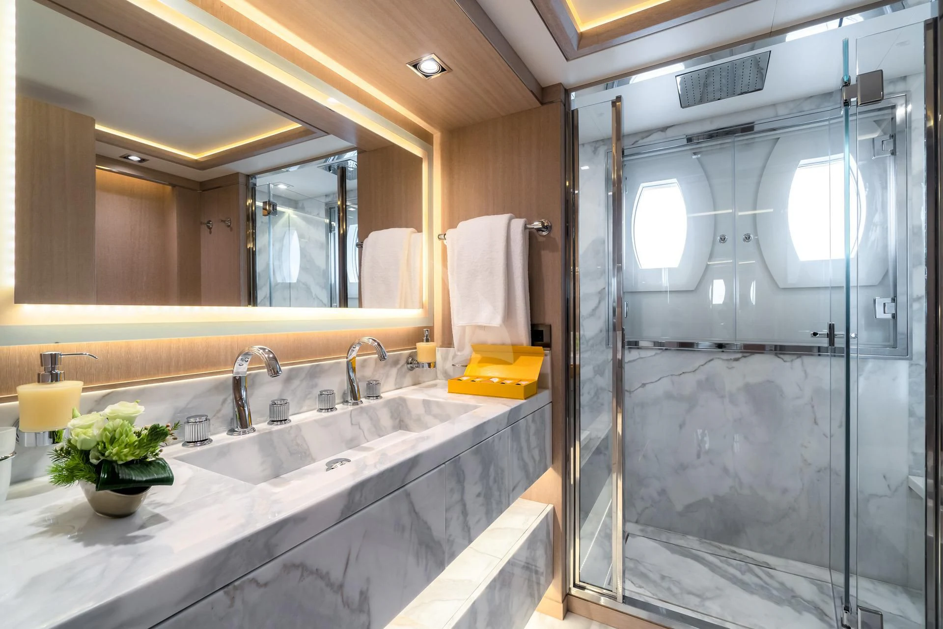a bathroom with a glass shower aboard JAZ Yacht for Charter