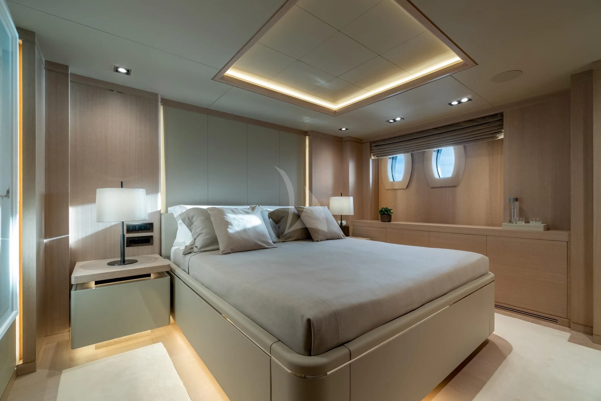 a room with a bed and a desk aboard JAZ Yacht for Charter