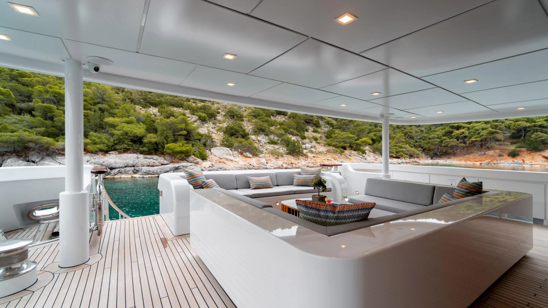 a large room with a large white table and chairs aboard JAZ Yacht for Charter