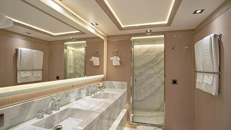 a bathroom with a glass shower aboard JAZ Yacht for Charter