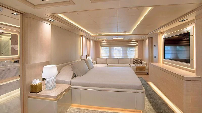 a room with a bed and a tv aboard JAZ Yacht for Charter