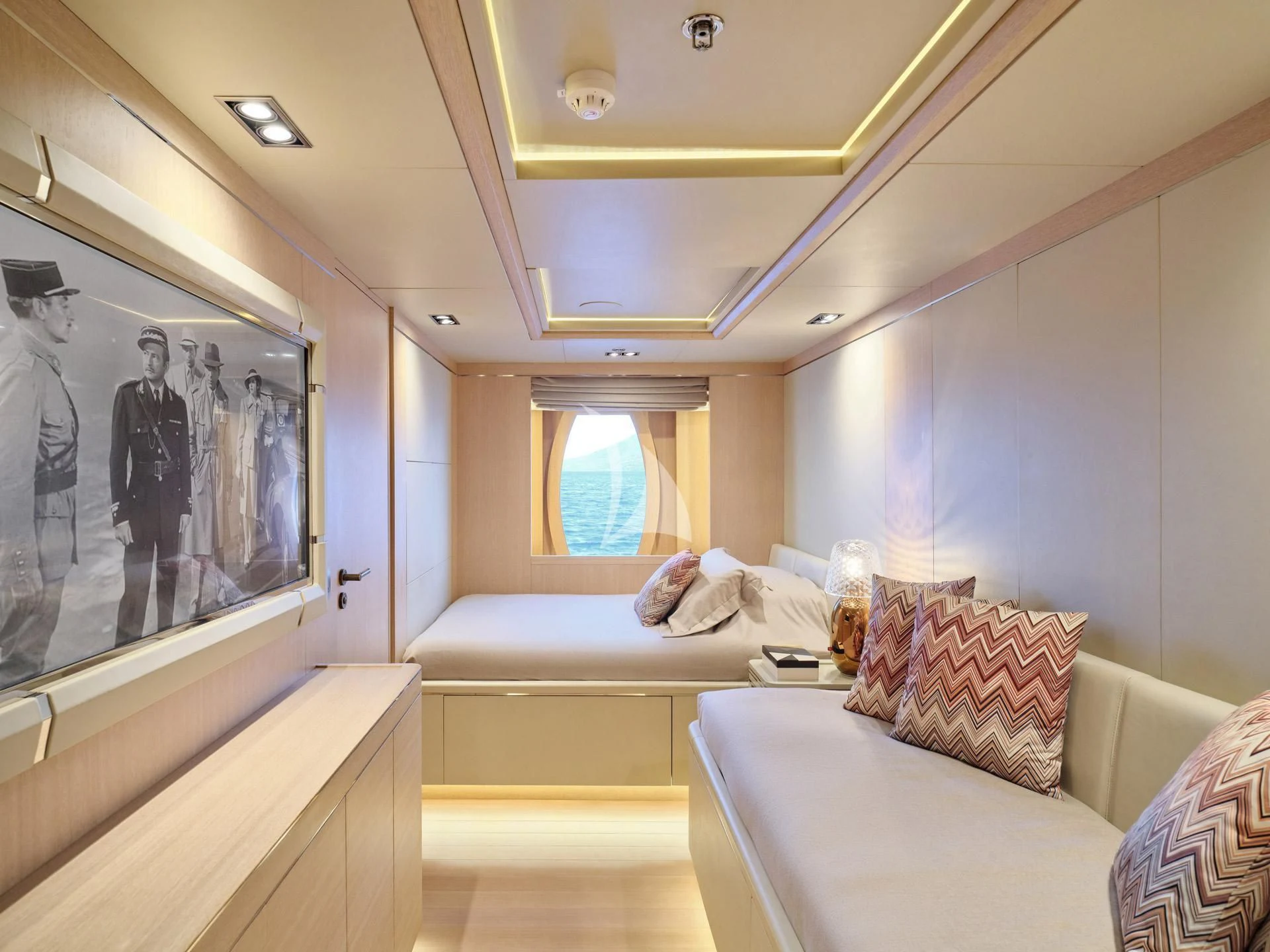a room with a couch and a television aboard JAZ Yacht for Charter