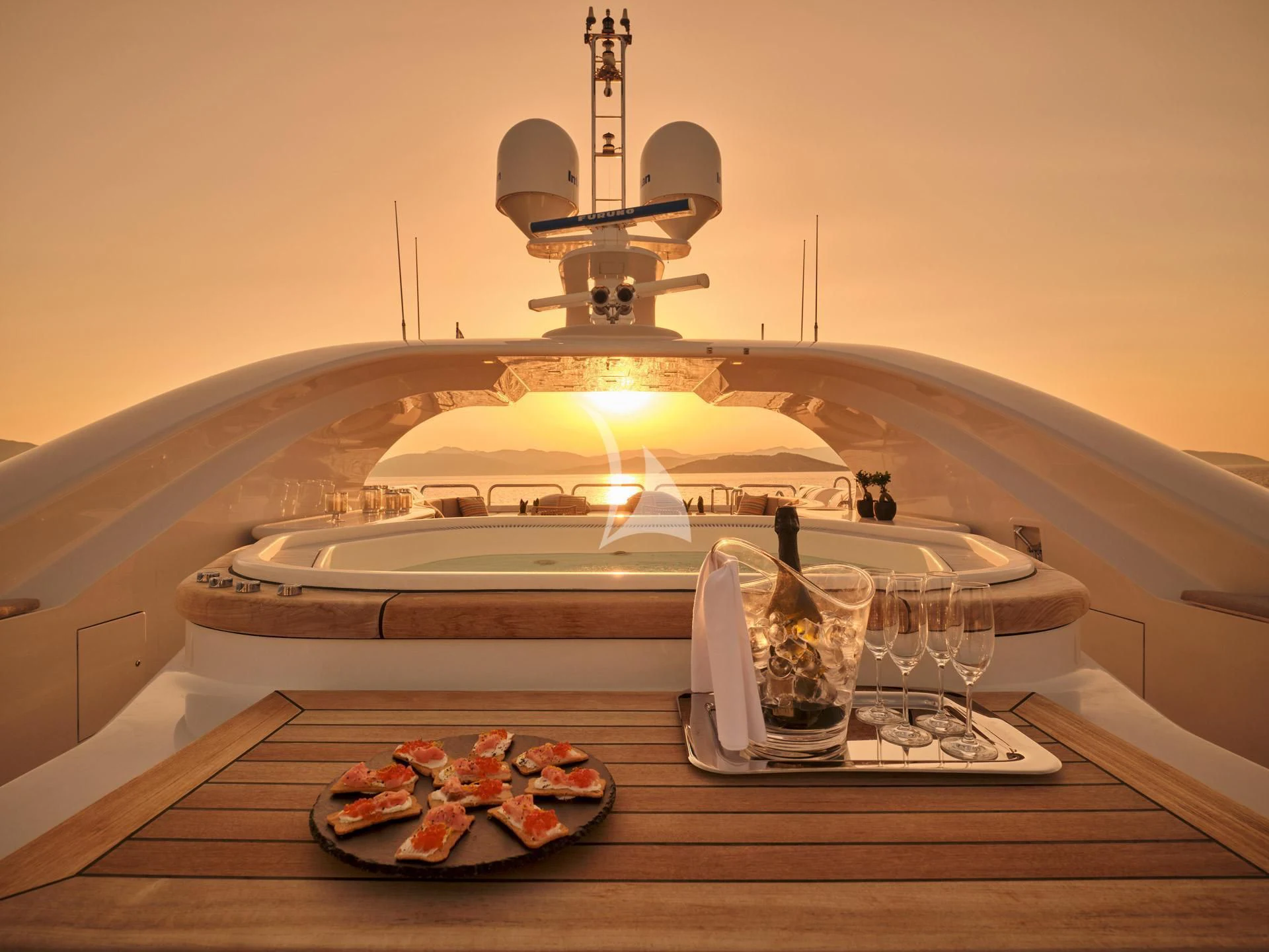 a large white boat with a chandelier above it aboard JAZ Yacht for Charter