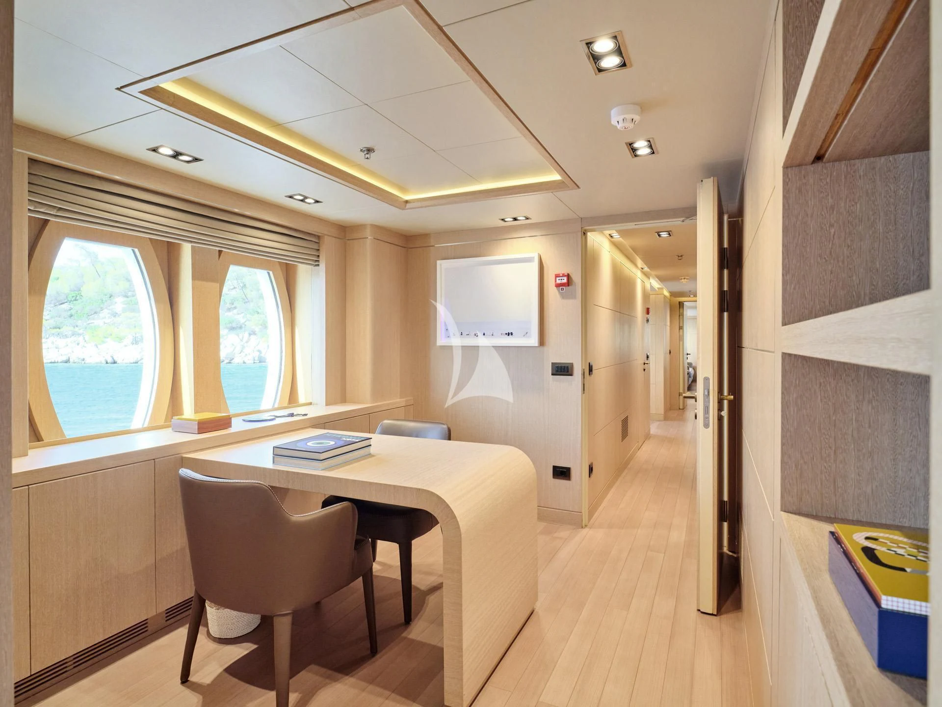 a room with a table and chairs aboard JAZ Yacht for Charter